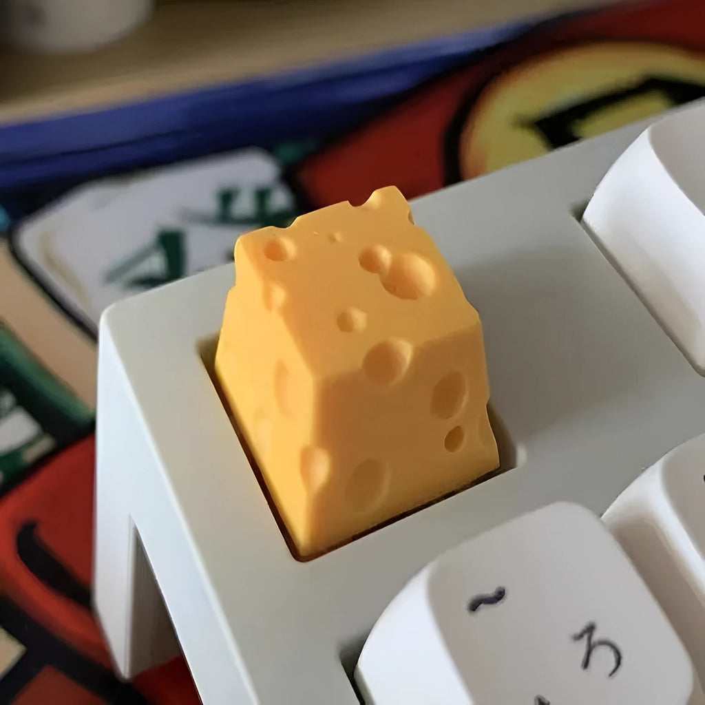 Yellow resin cheese wedge keycap for mechanical keyboards with MX stem mount.