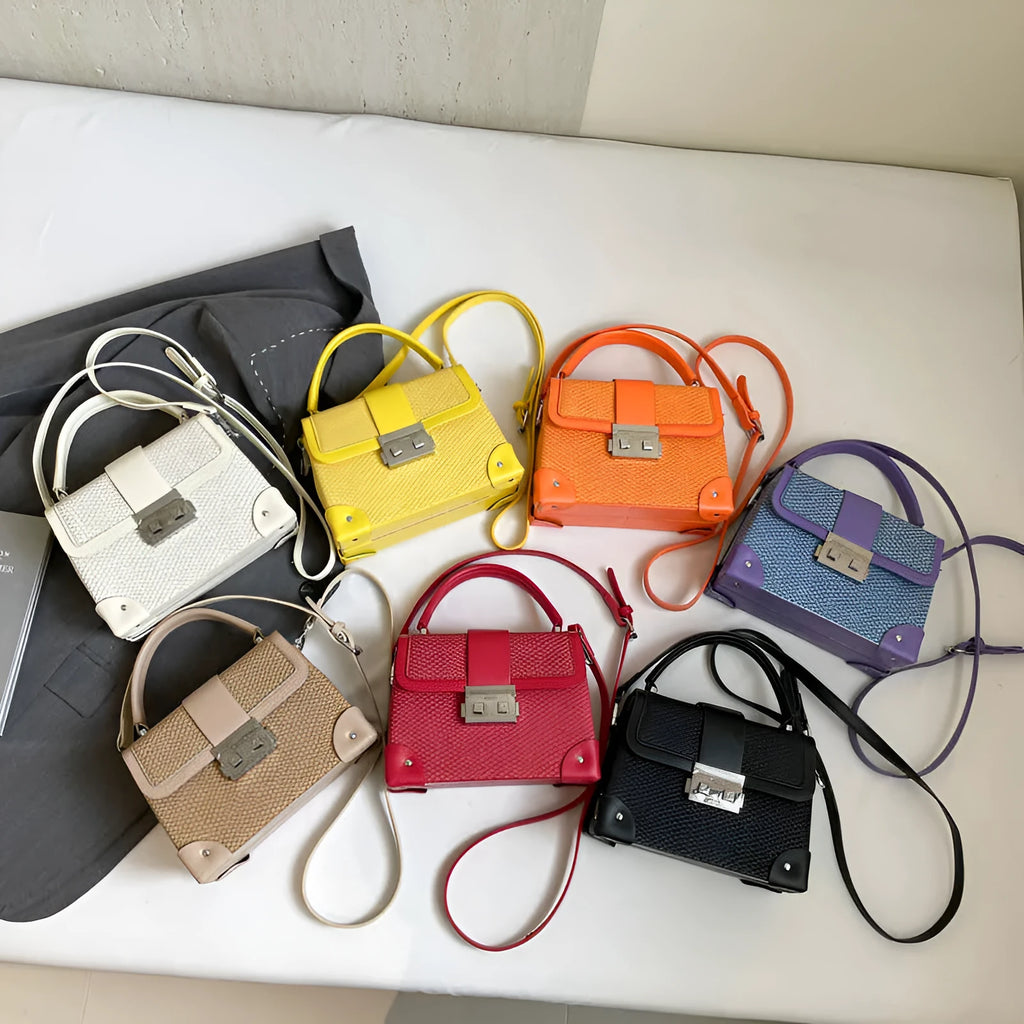 PU crossbody bag in horizontal square shape with sandwich outer pocket and seven colour options including black and orange
