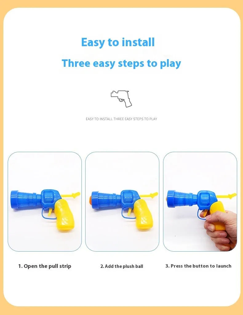 Plush ball launching gun for dogs next to a pile of soft coloured yarn balls.