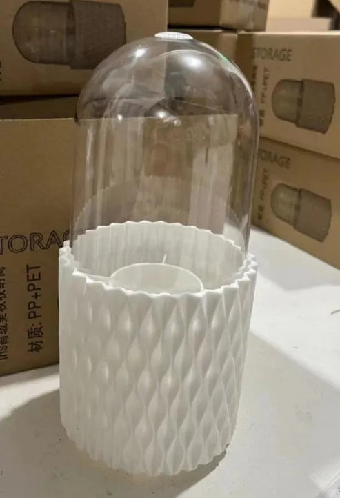 White transparent acrylic rotating makeup brush storage holder with dust-proof lid on desktop