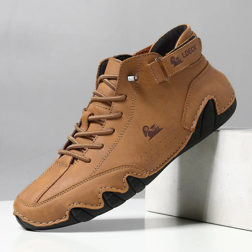 Men's khaki high top octopus shoes with round toe and mid-cut design on a rubber sole.