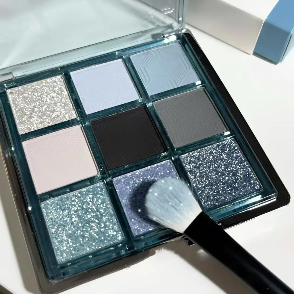 MUGELEEN nine-colour eye shadow palette showing low saturation blue and smoked shades