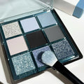 MUGELEEN nine-colour eye shadow palette showing low saturation blue and smoked shades