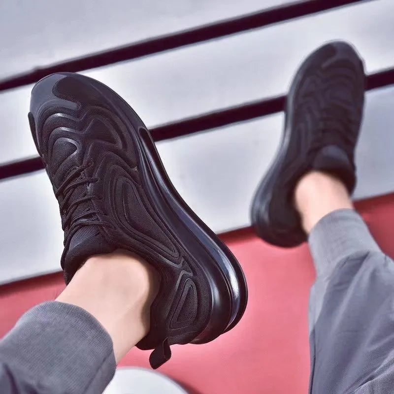 Men's black lace-up sneakers with a thick sole and round toe for outdoor sports.