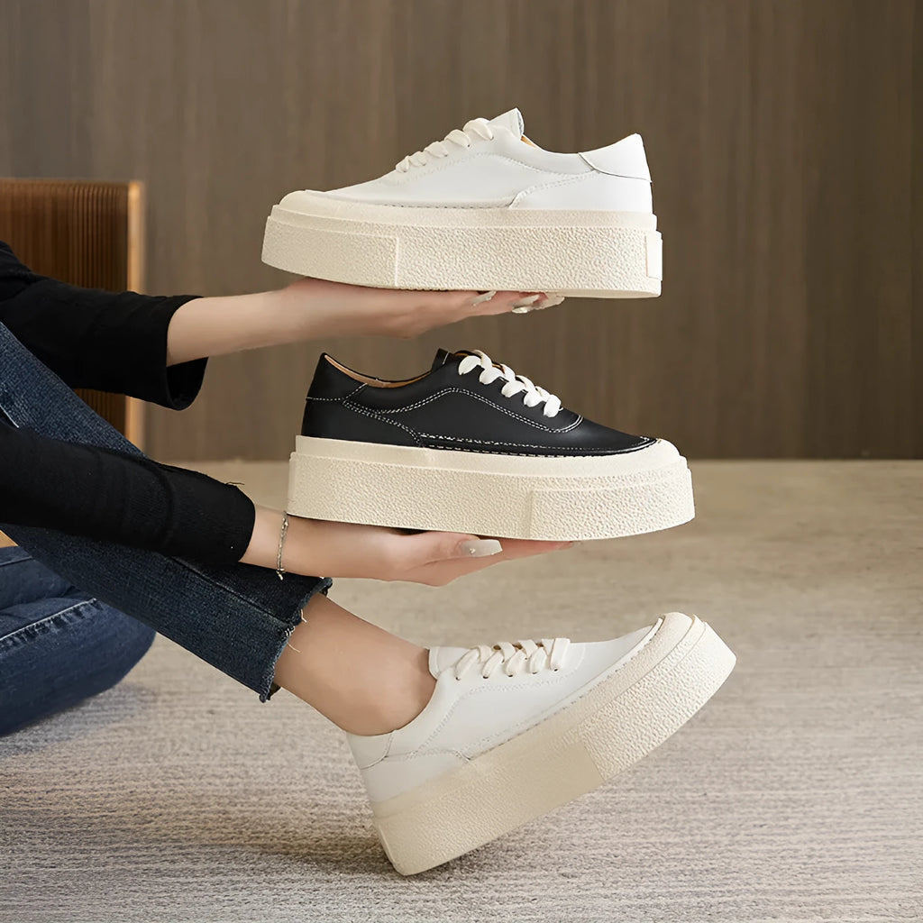 Women's black platform casual shoes with embossed cowhide texture and rubber sole