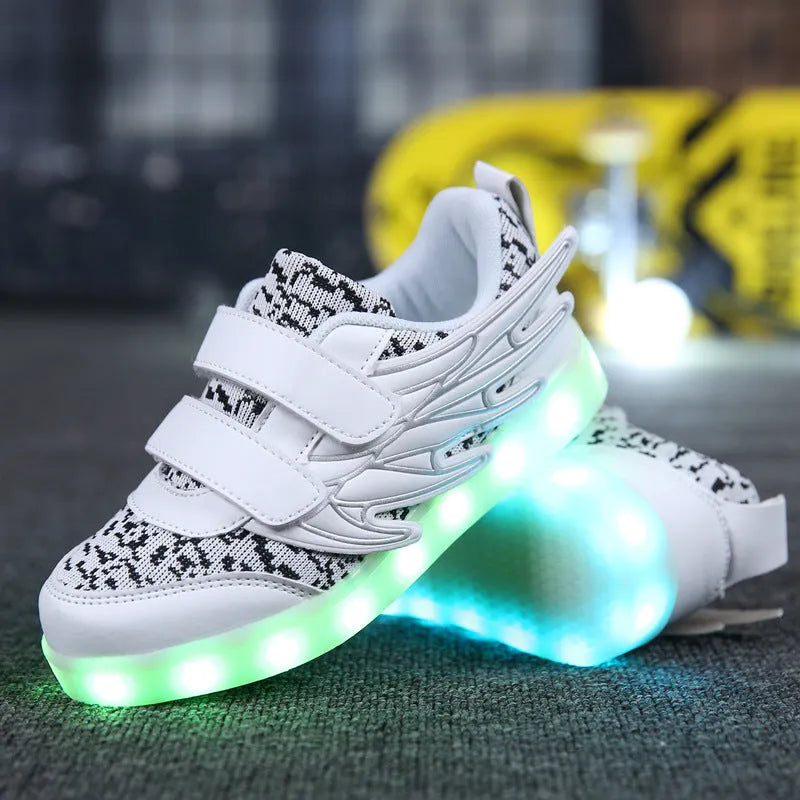 Plum red children's LED light-up sneakers on a white background, showing USB charging port.