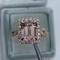 Rose gold geometric alloy ring on a plain background, showing its electroplated finish.