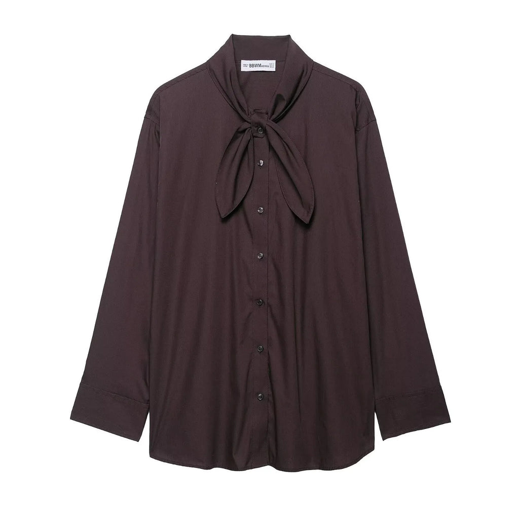 Brown women's loose-fit poplin shirt with long sleeves and a built-in bow tie detail.