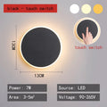 Round LED wall lamp 13cm diameter in black finish for bedside or corridor