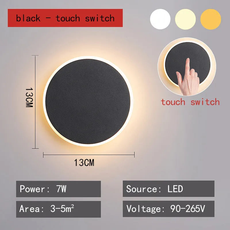 Round LED wall lamp 13cm diameter in black finish for bedside or corridor