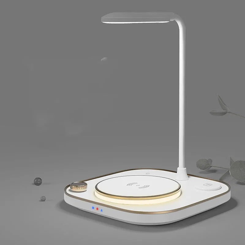 Black wireless charging desk lamp with 15W magnetic pad, Type-C cable, and USB outlet on a wooden desk.