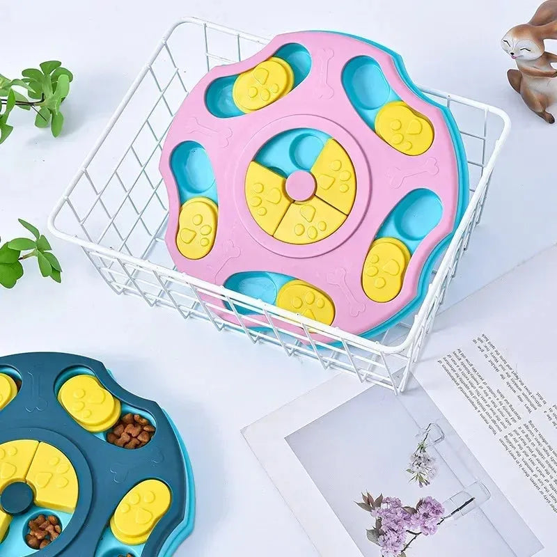 Blue and pink dog puzzle toy feeder bowl for aggressive chewers on a wooden floor.