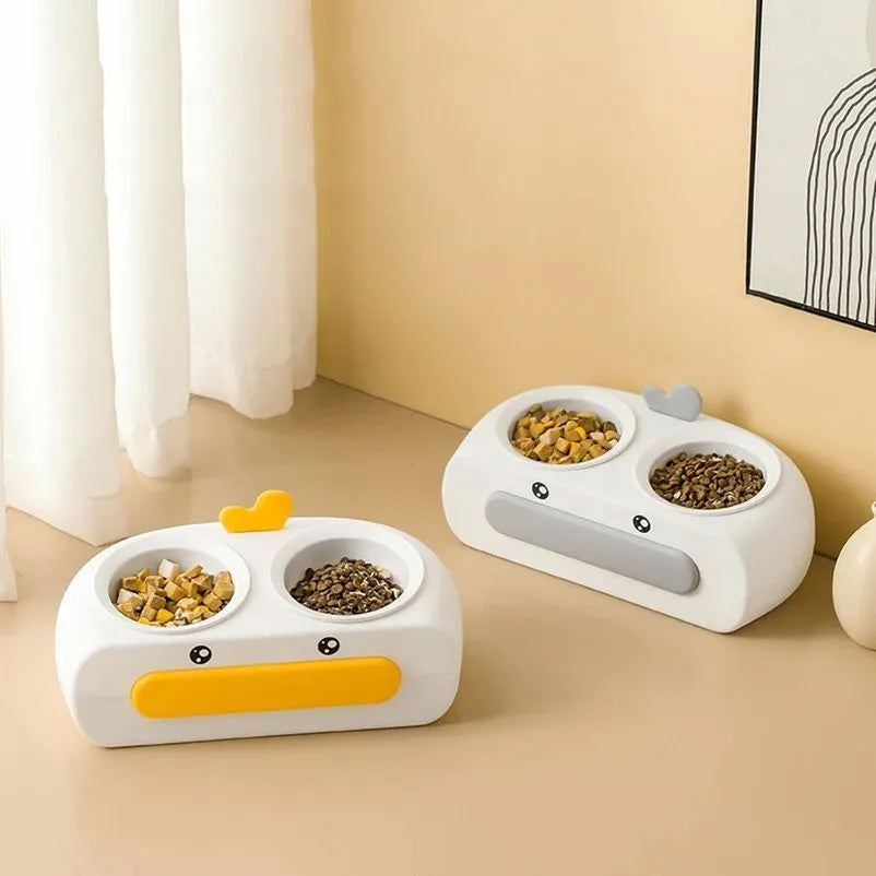 Duck design double pet bowl feeder tray in grey, pink, or yellow with plastic or stainless steel bowls for cats and small dogs.