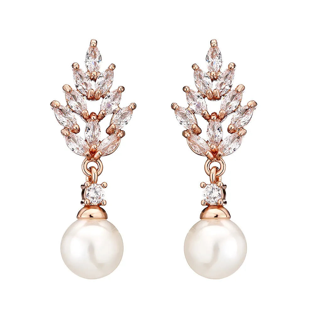 Geometric floral earrings with micro inlaid zircon and pearl details on copper with gold plating