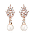 Geometric floral earrings with micro inlaid zircon and pearl details on copper with gold plating