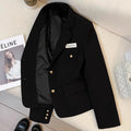 A women's black loose-fitting short suit coat with long sleeves and pockets.