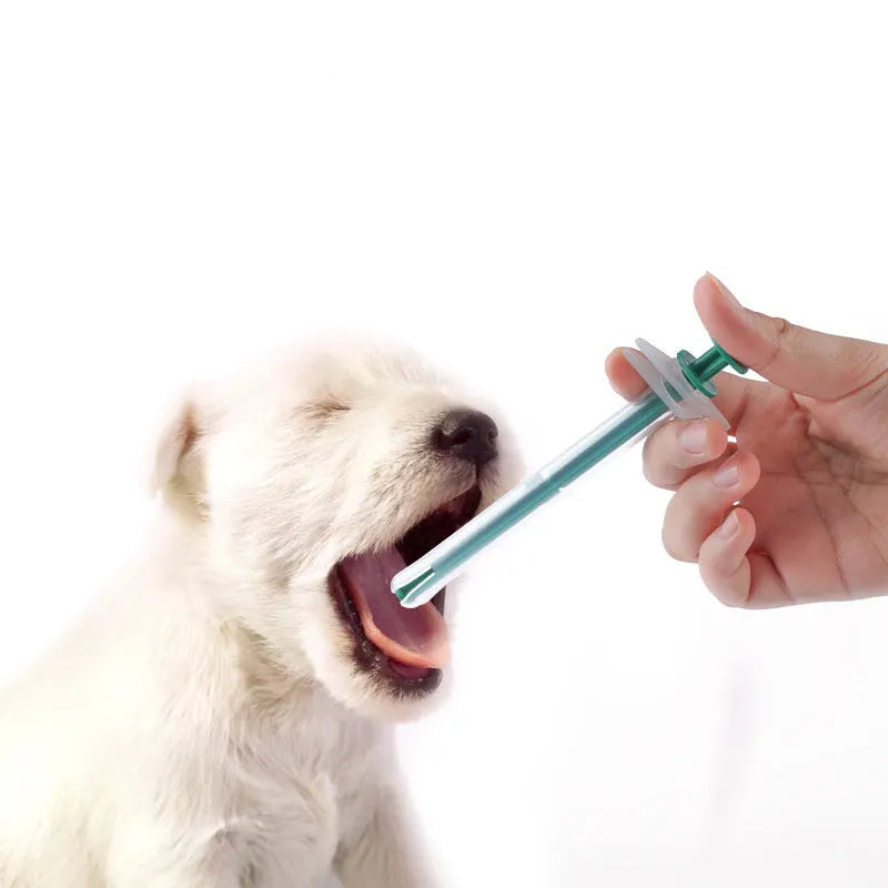 Two silicone pet pill shooter dispensers with soft tips for feeding medicine to cats and dogs