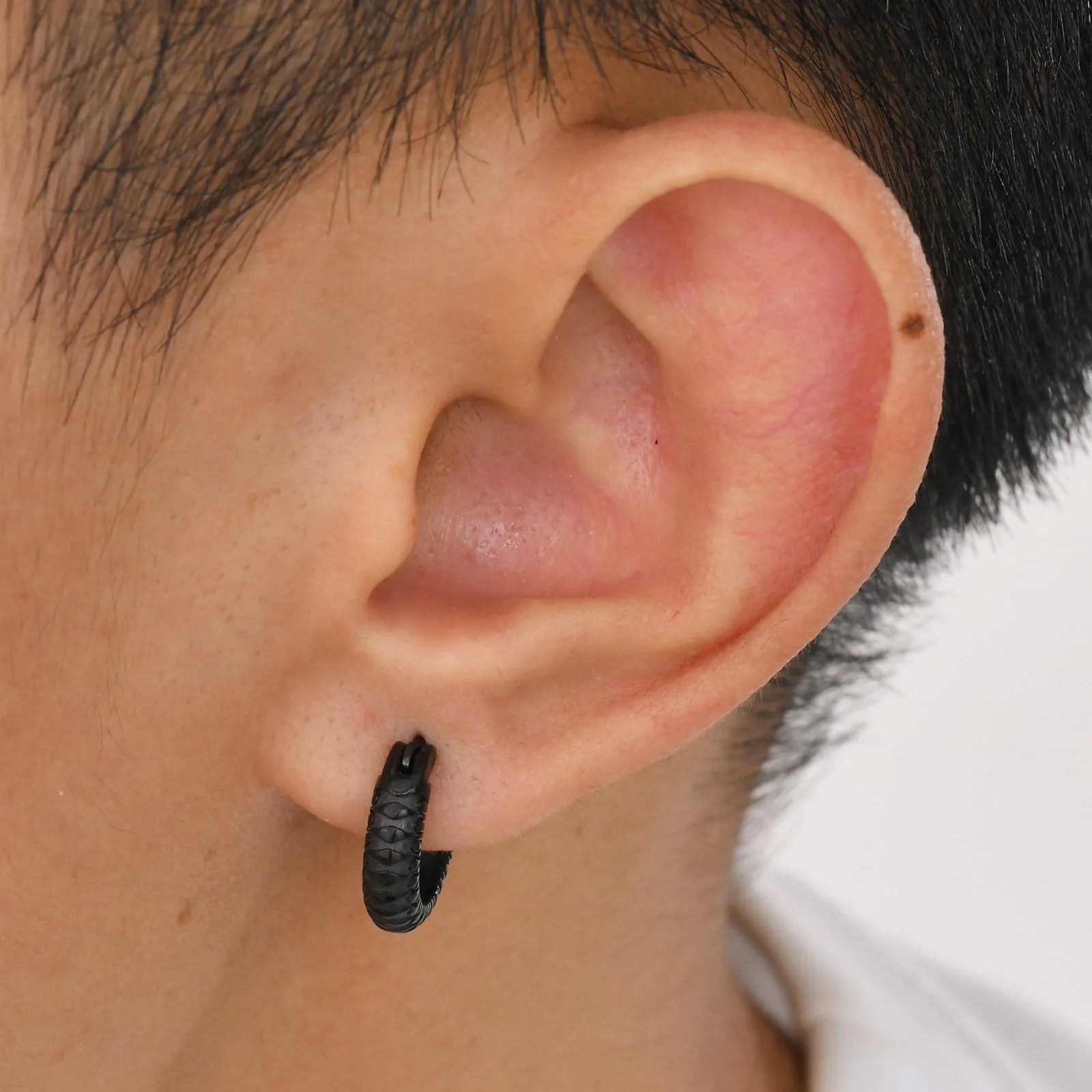 Stainless steel snake pattern earrings in black or gold colour options