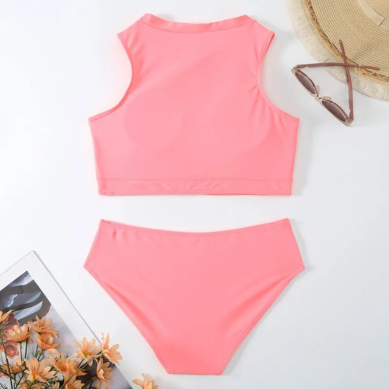 Pink high-waist split leg bikini swimsuit on a hanger, showing brief style and solid colour.