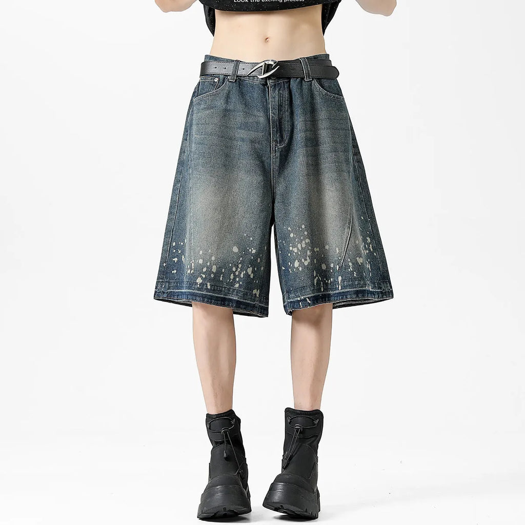 Men's retro blue washed denim shorts with ripped splash ink detailing, straight cut design