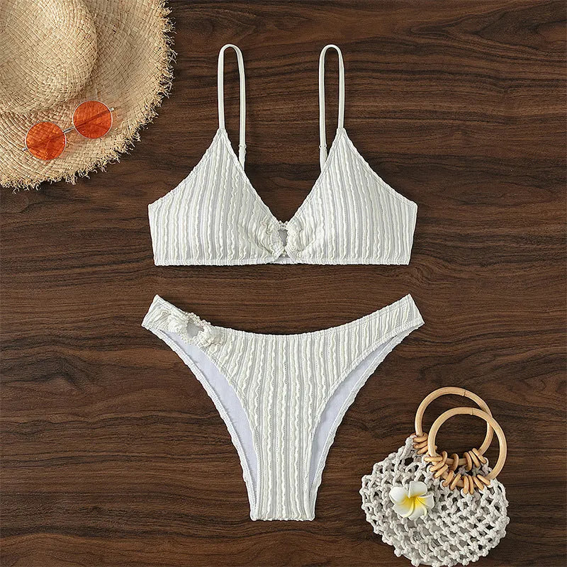 White women's V-neck swimsuit with sleeveless design and beach split styling