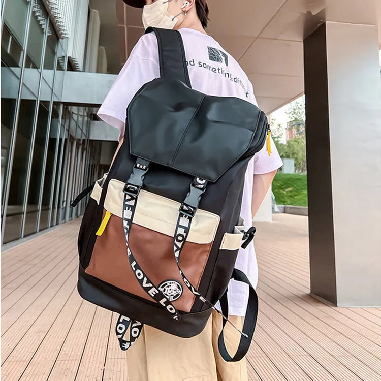 Oxford cloth backpack showing three carrying methods: handheld, shoulder, and backpack style