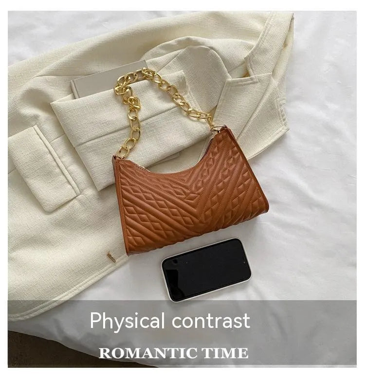 Brown pleated chain baguette shoulder bag showing vertical square shape and adjustable strap