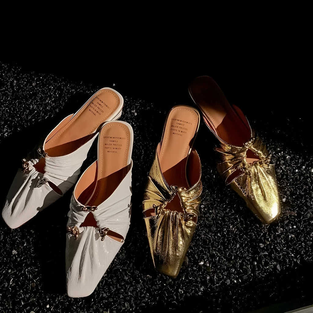 Women's genuine leather slipper with a square toe in a gold colour, showing the low heel and slip-on design.