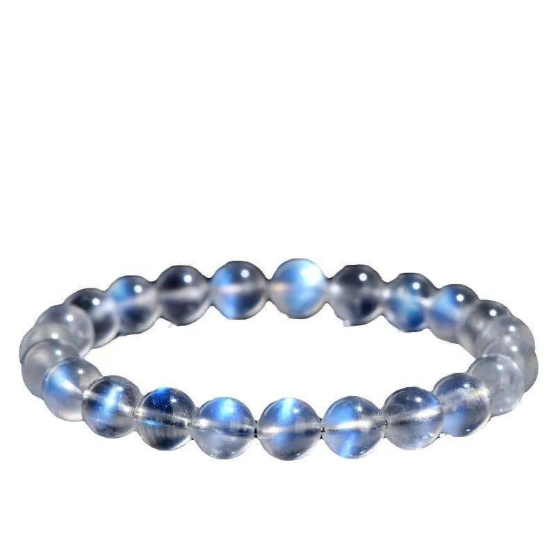 Natural cream body crystal bracelet with blue moonlight design showing minimalist unisex style