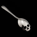 Stainless steel skull-shaped coffee mixing spoon in a colour finish