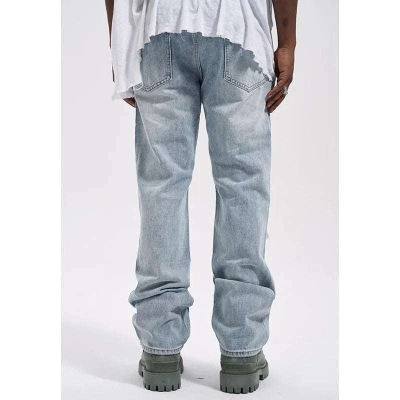 Vintage loose casual jeans for men in wash blue denim with relaxed fit and straight leg design