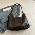 Women's PU leather shoulder bag with single strap in urban simplicity style showing horizontal square shape