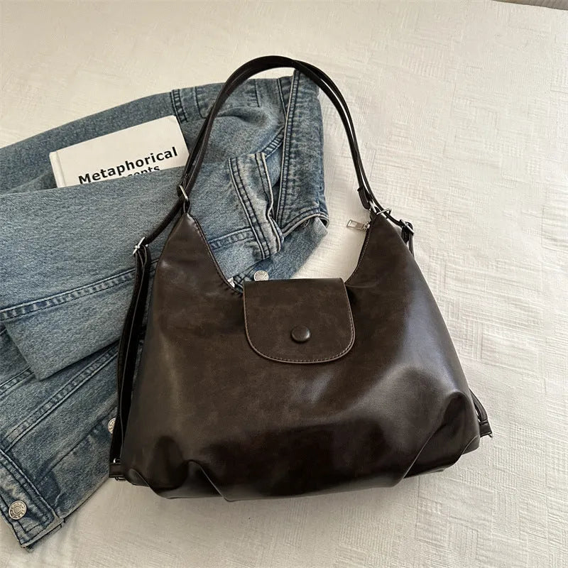Women's PU leather shoulder bag with single strap in urban simplicity style showing horizontal square shape