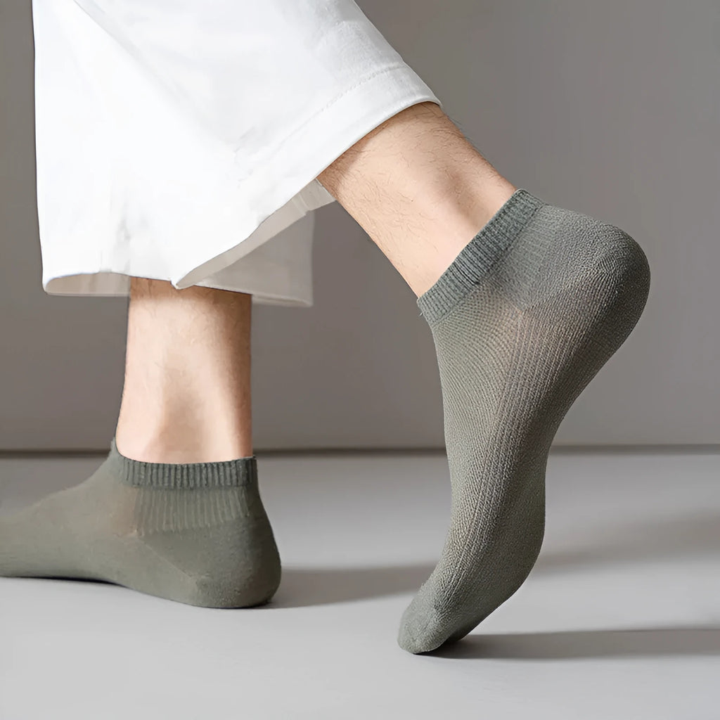 Men's solid colour polyester boat socks in low-cut design showing six colour variations