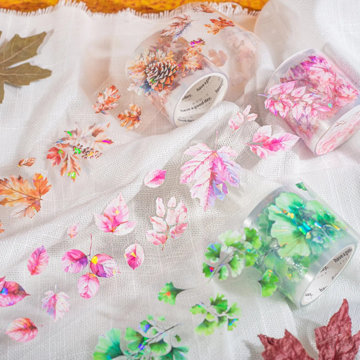 Roll of decorative PET stickers with six natural leaf patterns including ginkgo and maple designs