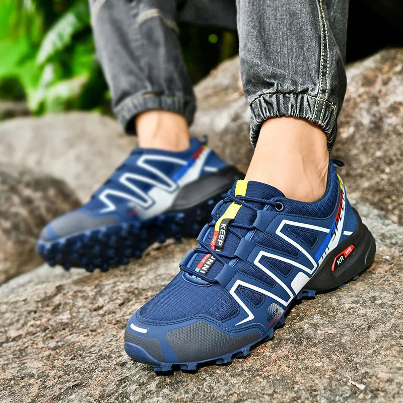Men's grey orange plus size casual running shoes with synthetic leather upper and rubber sole.