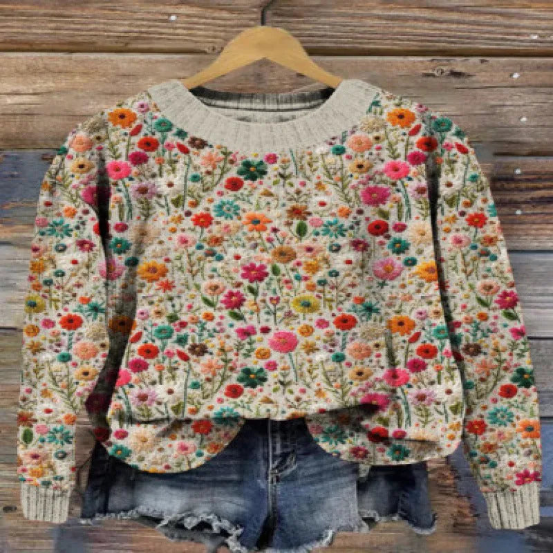 Women's round neck sweater with a small floral digital print pattern.
