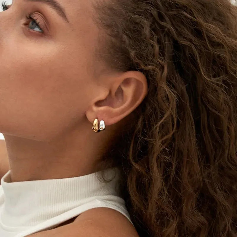 Pair of S925 sterling silver round hoop earrings with glossy electroplated finish in gold or white gold