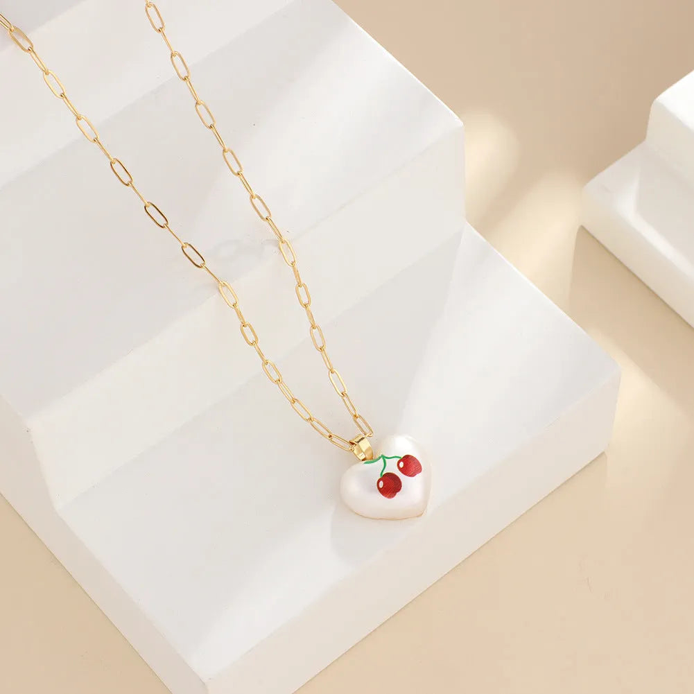 Geometric fruit pendant necklace on adjustable 21-50cm chain with strawberry, pineapple, apple, cherry, and pear colour options