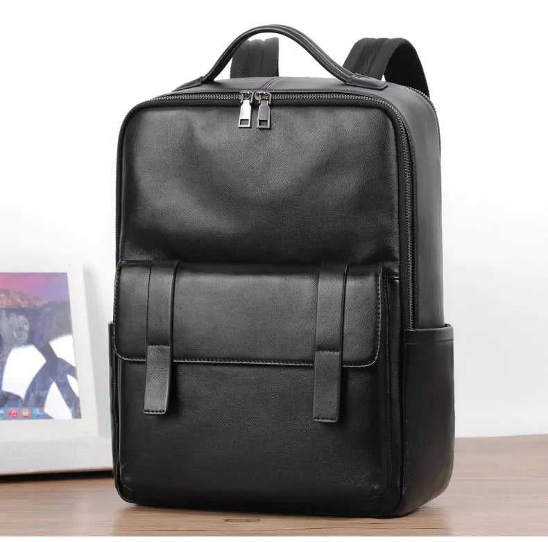 Large black leather men's computer backpack with weaving detail and a physiological curve back.