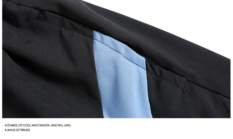 Loose fit quick-drying sports shorts in black, featuring an elastic waistband and straight-leg design.