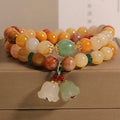 Women's natural jade multi-layer bracelet with orchid pendant on wrist