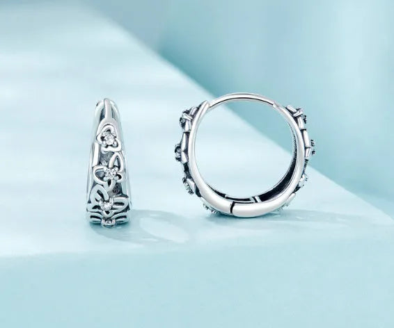 Sterling silver retro butterfly earrings with hollow design and zircon detailing