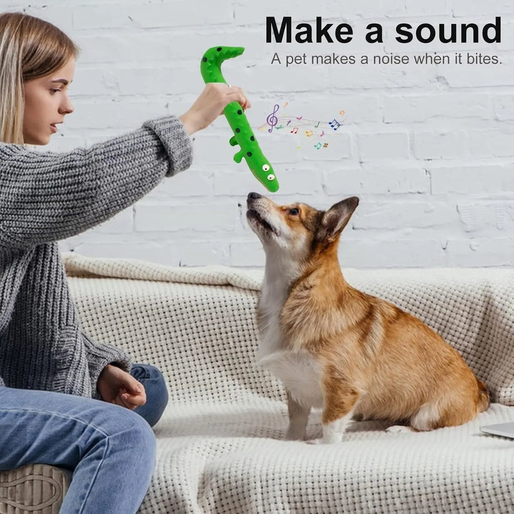 Green cartoon lizard shaped squeaky dog chew toy on a white background.