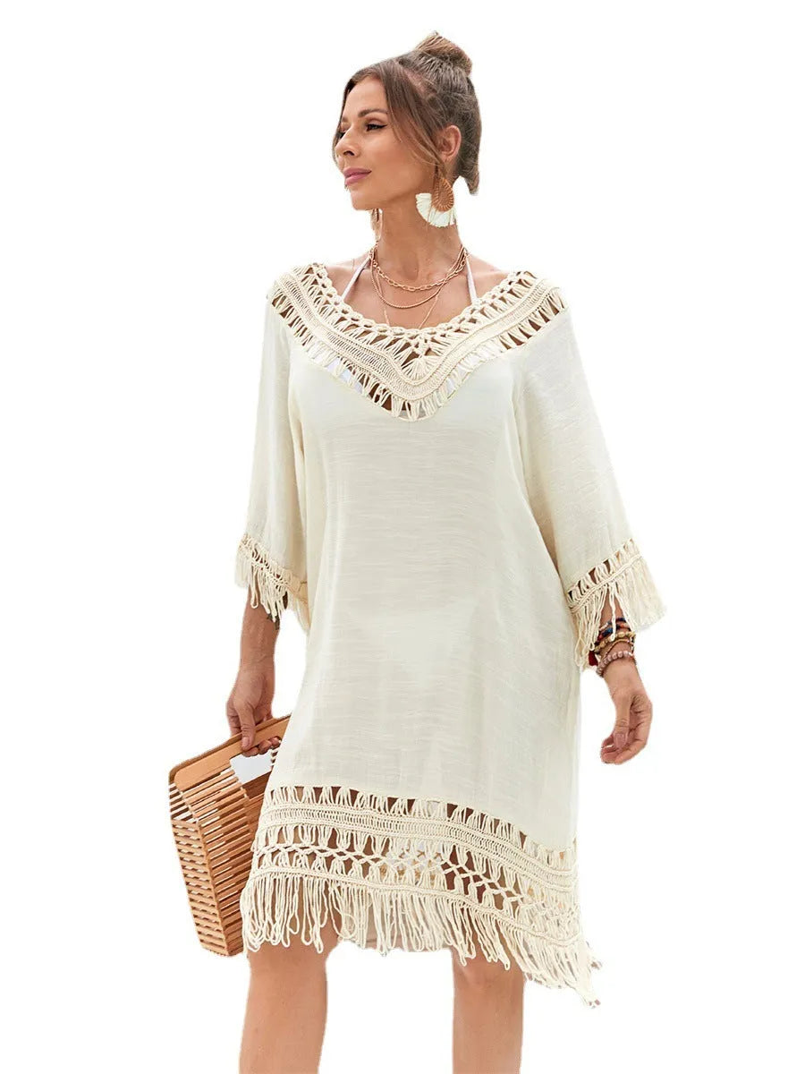 Apricot hand-crocheted long beach dress on a model, showing textured acrylic fabric