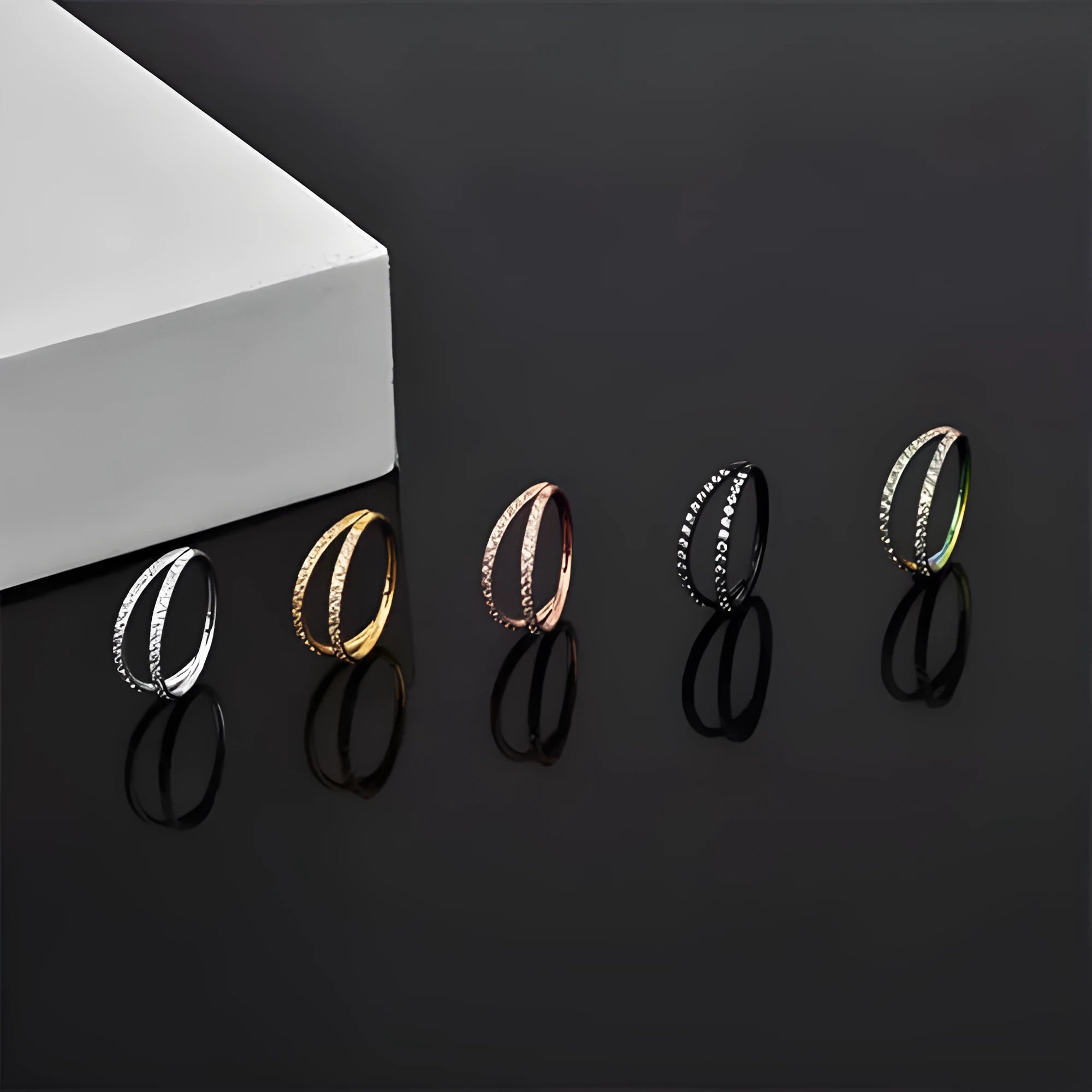 Titanium alloy nose ring with monoclinic diamond finish in gold and steel colour options showing precise measurements