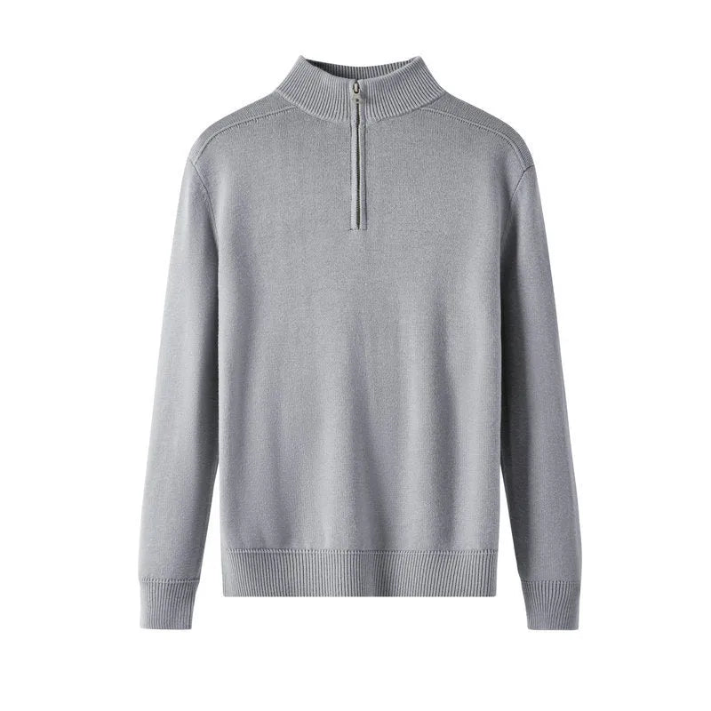 Man wearing a slim fit grey wool pullover sweater with long sleeves.