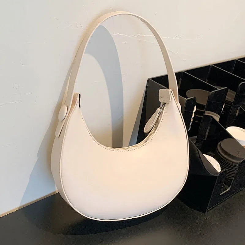 Retro dumpling-shaped women's shoulder bag in PU leather with sandwich pocket design