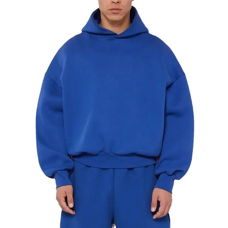 Men's grey fleece-lined pullover hoodie with wool interior showing long sleeves and solid colour design