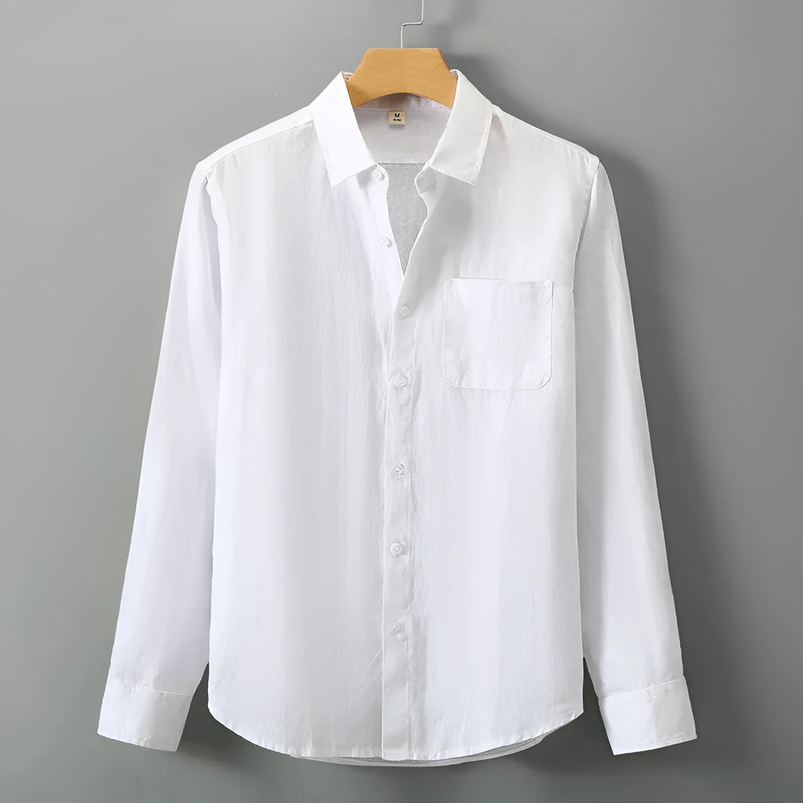 Chinese-style long sleeve linen cardigan in a loose fit, shown in a solid colour.